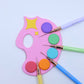 Colorful paint palette with paintbrushes 