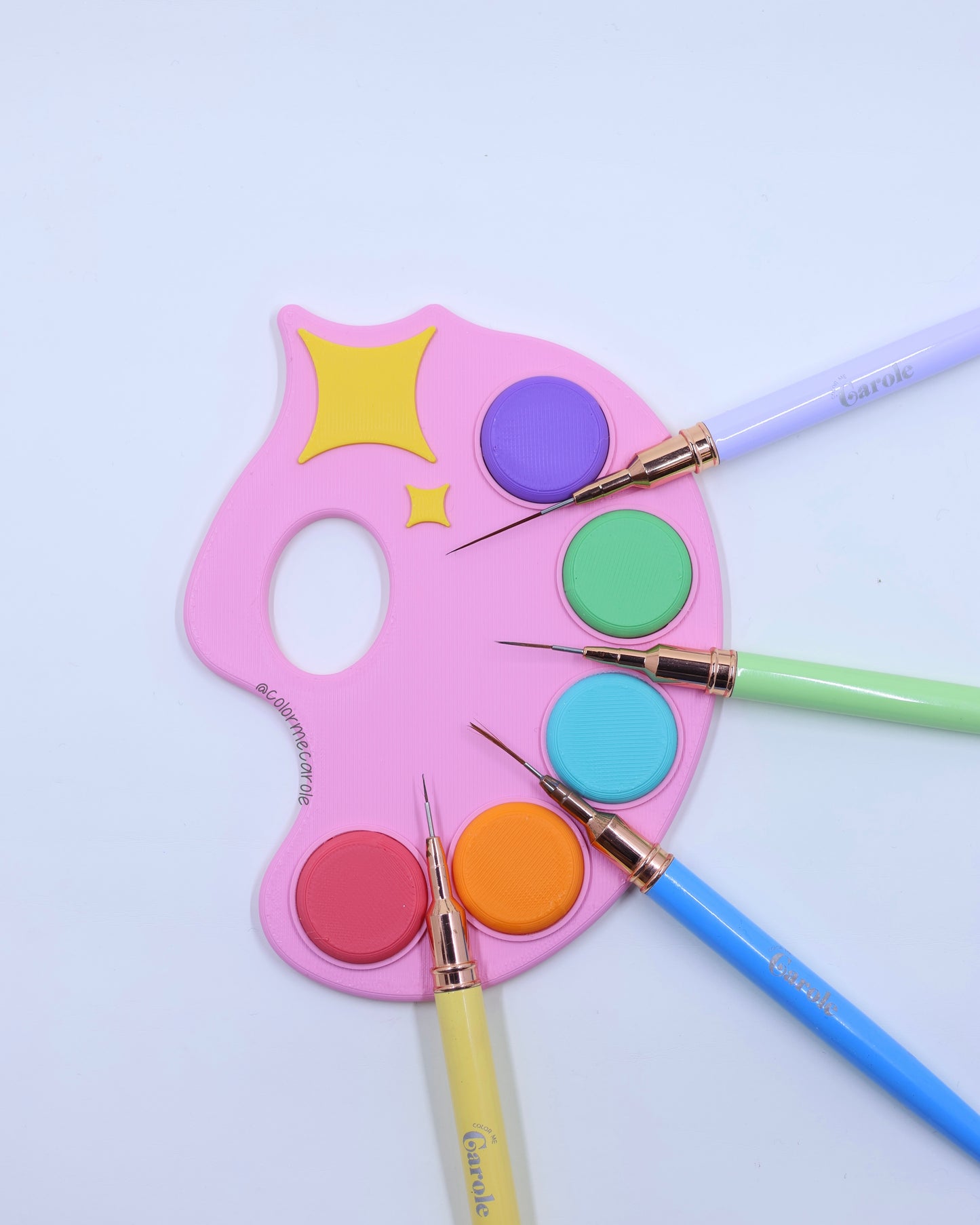 Colorful paint palette with paintbrushes 