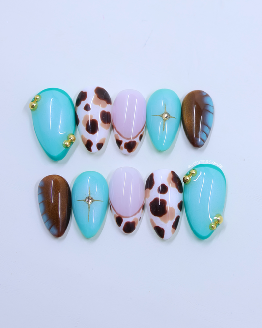 Set of nail art designs with turquoise, brown, and animal print patterns on a light background.
